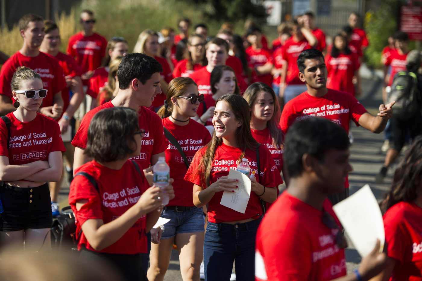 Lots of students wearing red "College of social sciences and humanities" shirts