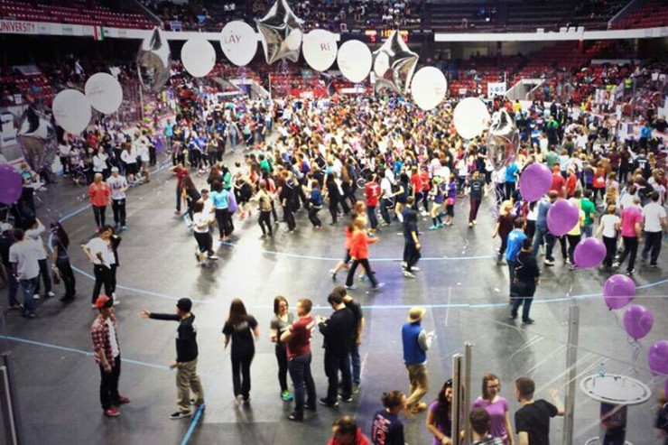 A large group of hundreds of people gather for the Relay for Life event